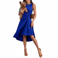 A woman with high heels shoes with a dog in her hands